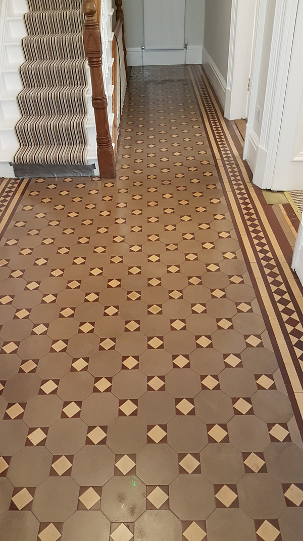 Image shows Victorian tiled floor after cleaning.