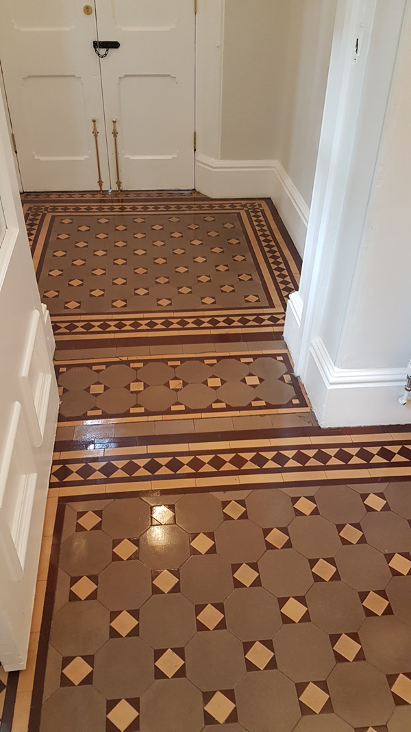 Image shows Victorian tiled floor after cleaning.
