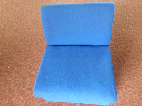 Image shows previously stained chair looking pristine after cleaning.
